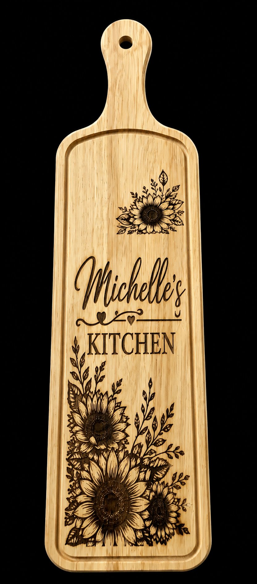 Long engraved wooden paddle board with sunflowers reading Michelle's Kitchen