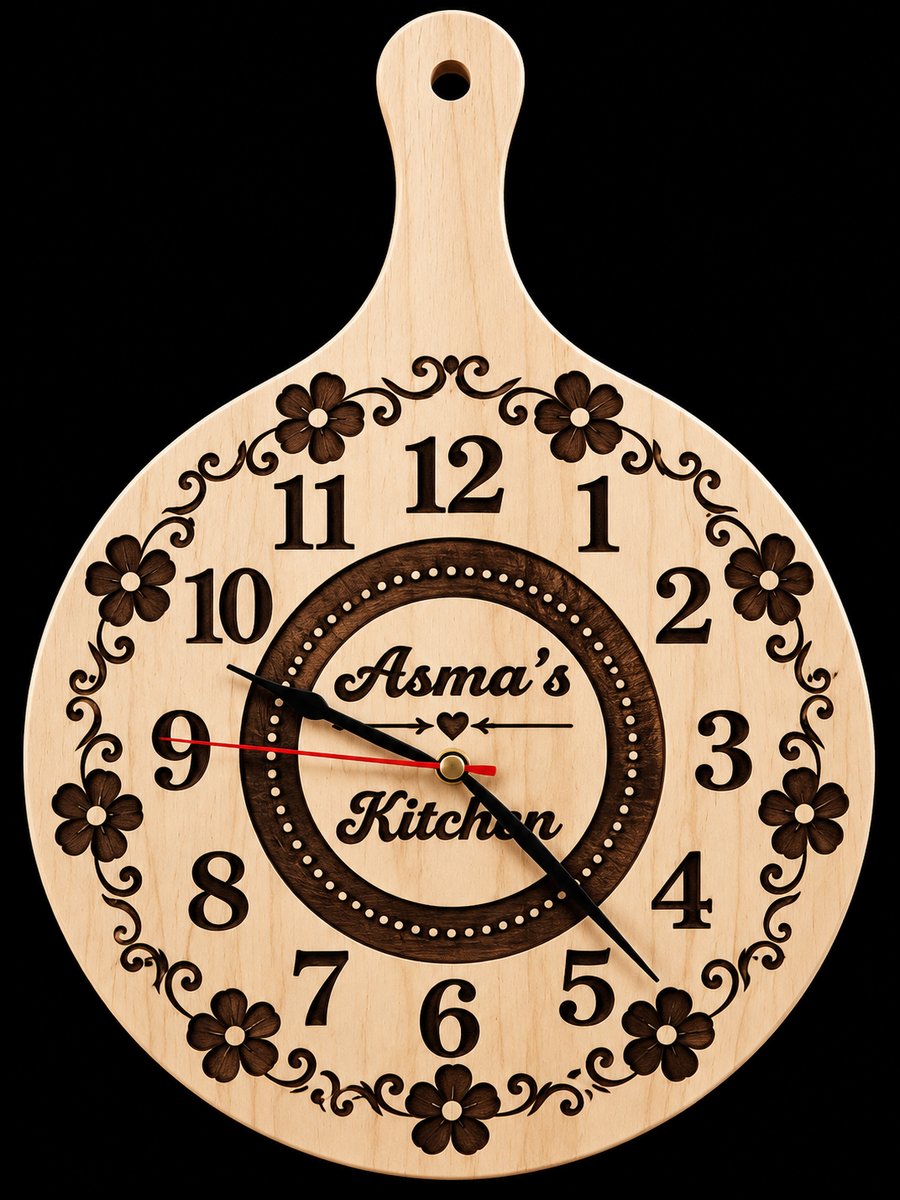 Engraved wooden paddle-shaped kitchen clock reading Asma's Kitchen with floral border