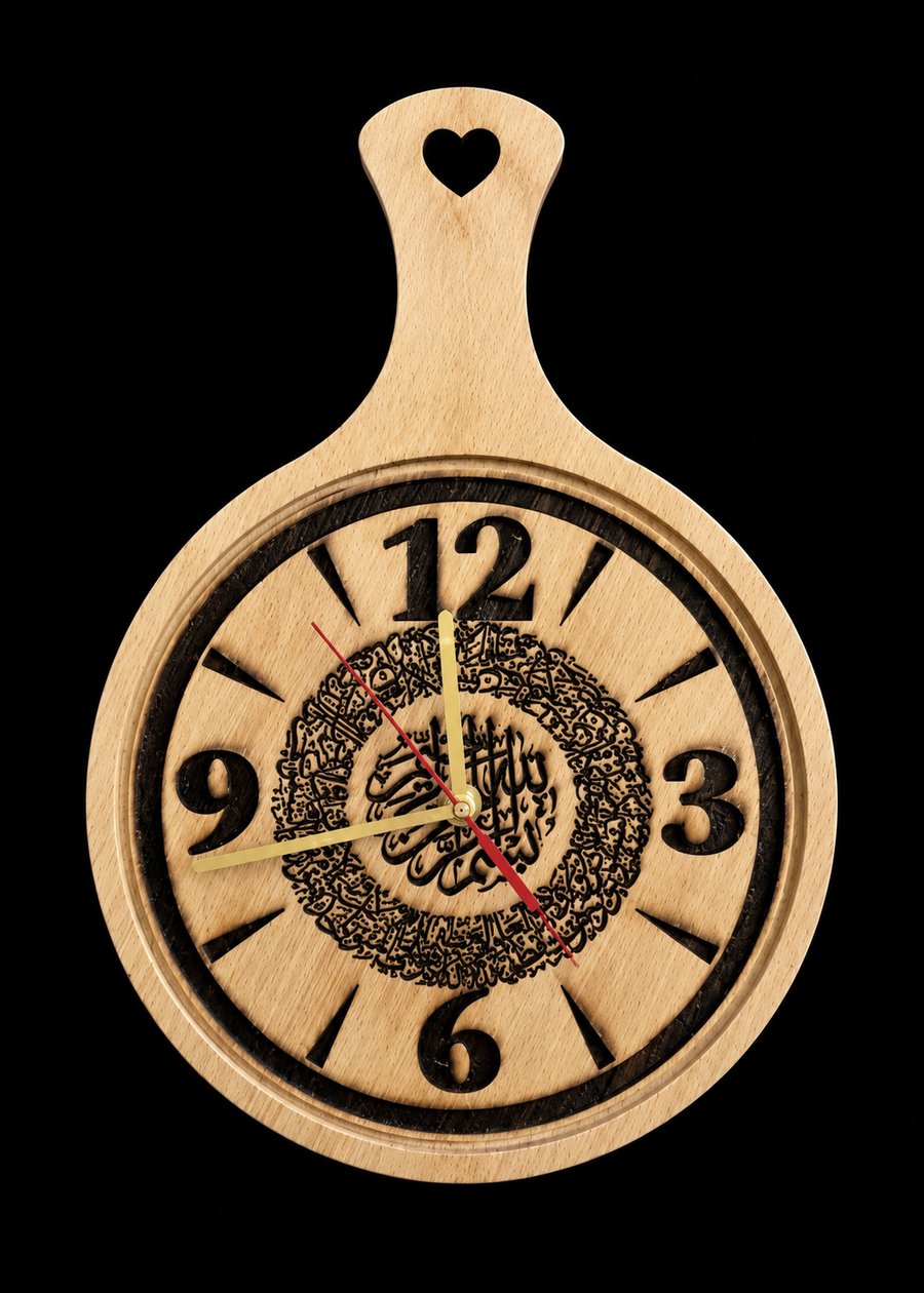 Engraved wooden paddle-shaped clock with heart cutout handle and Arabic calligraphy medallion